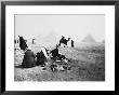 Camel Jockeys At The Giza Pyramids, Cairo, Egypt by Walter Bibikow Limited Edition Print