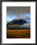 Clouds Over Volcano With Sunlit Plains In Foreground, Tongariro National Park, New Zealand by Johnson Dennis Limited Edition Print