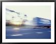 A Tractor Trailer Speeding Down A Highway At Sunset by Jason Edwards Limited Edition Print