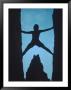 Silhouette Of Rock Climber Between Two Rocks by Chris Rogers Limited Edition Print