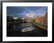 Excursion Boat On Canal In The Speicherstadt, The Historical Warehouse City Area, Hamburg, Germany by Yadid Levy Limited Edition Print