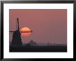 Windmill At Sunset by Fogstock Llc Limited Edition Print