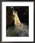 Man Crosses A Log Bridge Above A Waterfall On The Yagtali River by Randy Olson Limited Edition Print