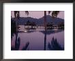 Reflections In A Pool And Traditional Malaysian Houses On Stilts by Eightfish Limited Edition Print