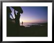 A Surfer Unloads A Board At Dawn In East Cape Of Baja, Mexico by Jimmy Chin Limited Edition Print