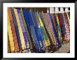 Colored Scarves Await Buyers At The Kom Ombo Marketplace by Stephen St. John Limited Edition Print