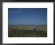 A Camper Sits On A Hill Looking Out Across A Plain by Taylor S. Kennedy Limited Edition Print