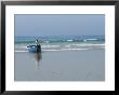 A Fisherman Waits For Help To Bring His Boat Back Up To The Beach by Heather Perry Limited Edition Print