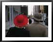 Rear View Of Two People Wearing Hats Stopped At A Crosswalk by Raul Touzon Limited Edition Print