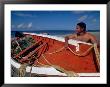 Fisherman Tends His Boat On The Beach, Isla Margarita, Venezuela by Greg Johnston Limited Edition Pricing Art Print
