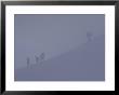 Climbers Are Barely Visible On The Cloudy Mountain Side by Paul Chesley Limited Edition Print