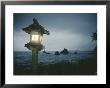 A Small Wooden Lantern Looks Out Over The Dark Sea by Luis Marden Limited Edition Pricing Art Print