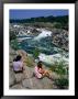 Girls Sitting On Rocks By Potomac River, Great Falls National Park, Usa by Mark & Audrey Gibson Limited Edition Print