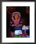 Hmong Village Woman Wearing A Tribal Hat At A Cloth Stall, Chiang Mai, Thailand by Ryan Fox Limited Edition Print