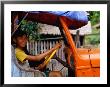 Boy Pretending To Drive Truck In Mrauk-U Village, Looking At Camera, Mrauk U, Myanmar (Burma) by Corey Wise Limited Edition Pricing Art Print