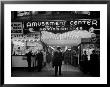 Sailors, Soldiers And Other Customers Standing Outside Of Neon Lit Amusement Arcade by Peter Stackpole Limited Edition Print