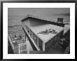 Guests Playing Cards And Sunbathing At Cliffside Home Of W. M. Macconnell by Peter Stackpole Limited Edition Print