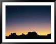 Sunset Silhouetting The Desert Landscape by Rich Reid Limited Edition Print