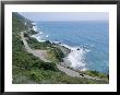 A Car Whizzes Down Hwy 1 Along Californias Big Sur Coastline by Rich Reid Limited Edition Print