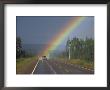 A Car On A Highway Drives Close To A Rainbow by Paul Nicklen Limited Edition Print