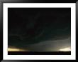 Lightning And Dark Clouds Over A Prairie Foretell A Possible Tornado by Peter Carsten Limited Edition Print