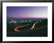 Time Exposure Of Headlights Streaking Down A Highway At Twilight by Dick Durrance Limited Edition Print