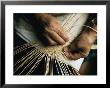 Close View Of The Hands Of A Hupa Indian Weaving A Basket by Dick Durrance Limited Edition Print