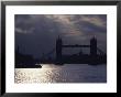 The Recently Renovated Tower Bridge Is Nearly Silhouetted Against A Cloudy London Sky by O. Louis Mazzatenta Limited Edition Print