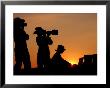 Three Us Air Force Members Highlighted By The Setting Sun by Stocktrek Images Limited Edition Print