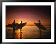 Three Surfers Hold Surfboards On Beach At Sunset by Doug Mazell Limited Edition Pricing Art Print
