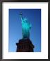 The Statue Of Liberty Against A Cityscape In Smog by Kurt Freundlinger Limited Edition Print
