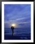 Silhouette Of Mother And Child On Beach At Sunset by Greg Smith Limited Edition Pricing Art Print