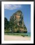 Boats And Rock Formation At Railey Beach On The Andaman Sea Coast by Mark Cosslett Limited Edition Print