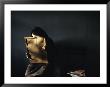 A Grieving Woman Holds A Photograph Of Her Murdered Son by James L. Stanfield Limited Edition Pricing Art Print