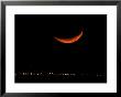 A Crescent Moon Dwarfs The Lights Of Fort Riley Army Base In Central Kansas, January 22, 2007 by Charlie Riedel Limited Edition Print