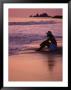 Woman Sitting On Beach At Sunset In Ixtapa, Near Zihuatanejo, Zihuatanejo, Mexico by Philip Smith Limited Edition Pricing Art Print