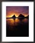 Sunset Over Coastal Rocks And Couple Walking On Beach, Devilas Elbow State Park, Usa by Mark & Audrey Gibson Limited Edition Print
