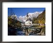 Wooden Bridge In Front Of The Church At Ramsau In The Mountains Of Bavaria, Germany by Gavin Hellier Limited Edition Print