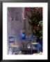 Chairs And Table Outside Of Building, Greece by Rick Strange Limited Edition Pricing Art Print