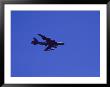 A Military Jet Speeds Through A Clear Blue Sky by Raul Touzon Limited Edition Print
