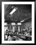 Soda Fountain Proprietor Watching As Kids Use Drinking Straw Covers As Straw Blowgun Missiles by Wallace Kirkland Limited Edition Print