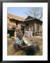 Woman Cleaning Pot Outside Her House, Near Siem Reap, Cambodia, Indochina, Southeast Asia by Jane Sweeney Limited Edition Print