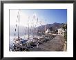 Yachts, Livadhia, Island Of Tilos, Dodecanese, Greece by Ken Gillham Limited Edition Print