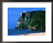 People In Water At Tumon Beach With Amantes (Two Lovers) Point Behind, Tumon, Guam by John Elk Iii Limited Edition Print