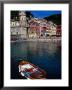 Brightly Coloured Buildings Of Cinque Terre With Rowboat In Foreground, Vernazza, Italy by Glenn Beanland Limited Edition Print