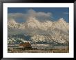 A View Of The Mormon Row Barn And The Grand Tetons Behind by Ira Block Limited Edition Print