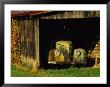 Vintage Automobile Is Parked In A Barn by Raymond Gehman Limited Edition Pricing Art Print