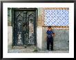 Boy Standing Near Door Of Historic House, Baghdad, Iraq by Jane Sweeney Limited Edition Print