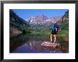 Hiker Stands On A Rockoverlooking Maroon Bells, Aspen, Colorado, Usa by Cheyenne Rouse Limited Edition Print