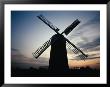 Windmill Silhouetted Against Sky At Sunset, The Cotswolds, Wiltshire, England by Jon Davison Limited Edition Print